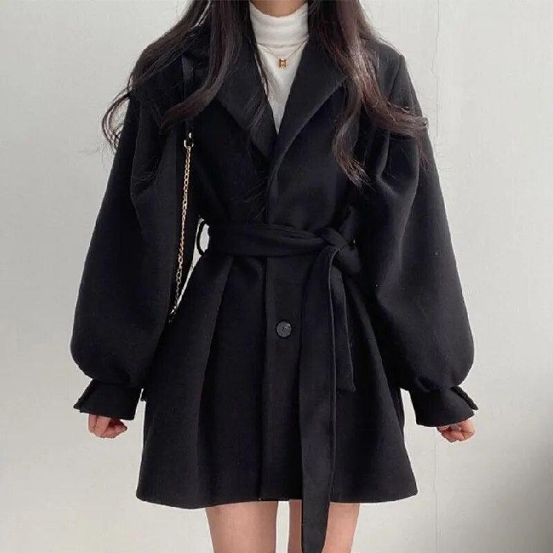 Manteau noir élégant à ceinture, manches bouffantes, style chic et abordable pour femme