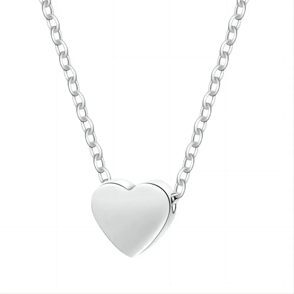 Collier point lumineux zircon – chaîne cœur argentée