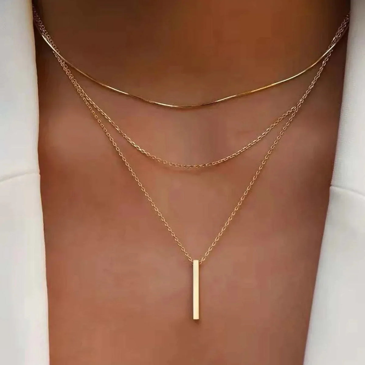 Collier multirang à pendentif barre – doré