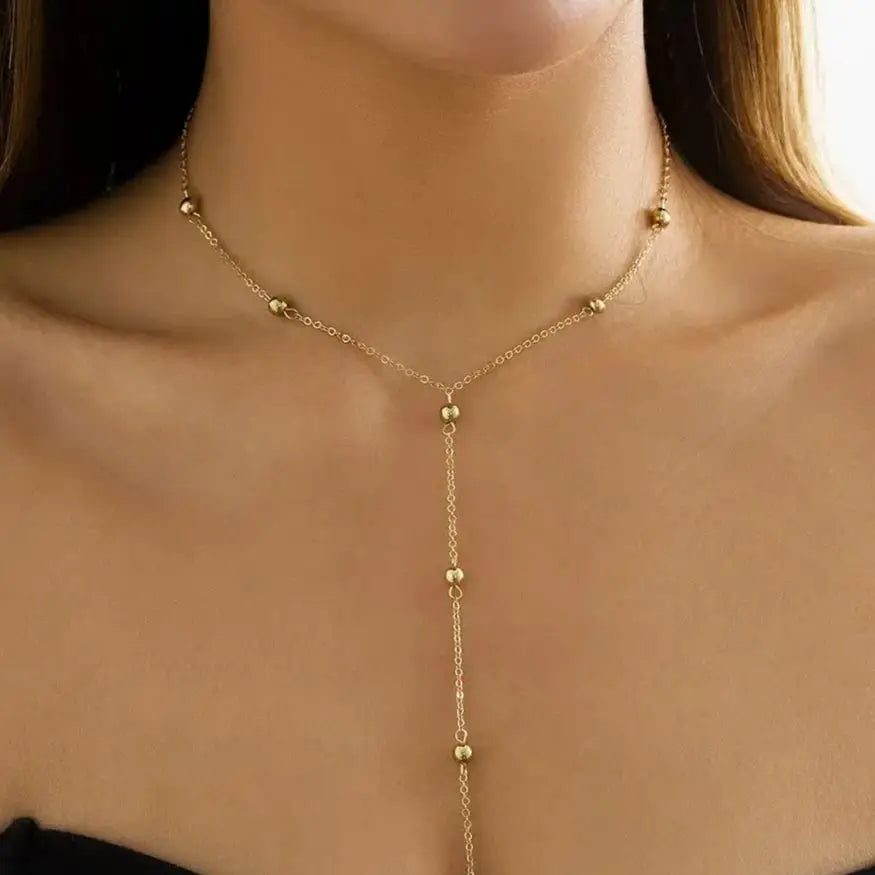 Collier ras du cou en Y à billes dorées