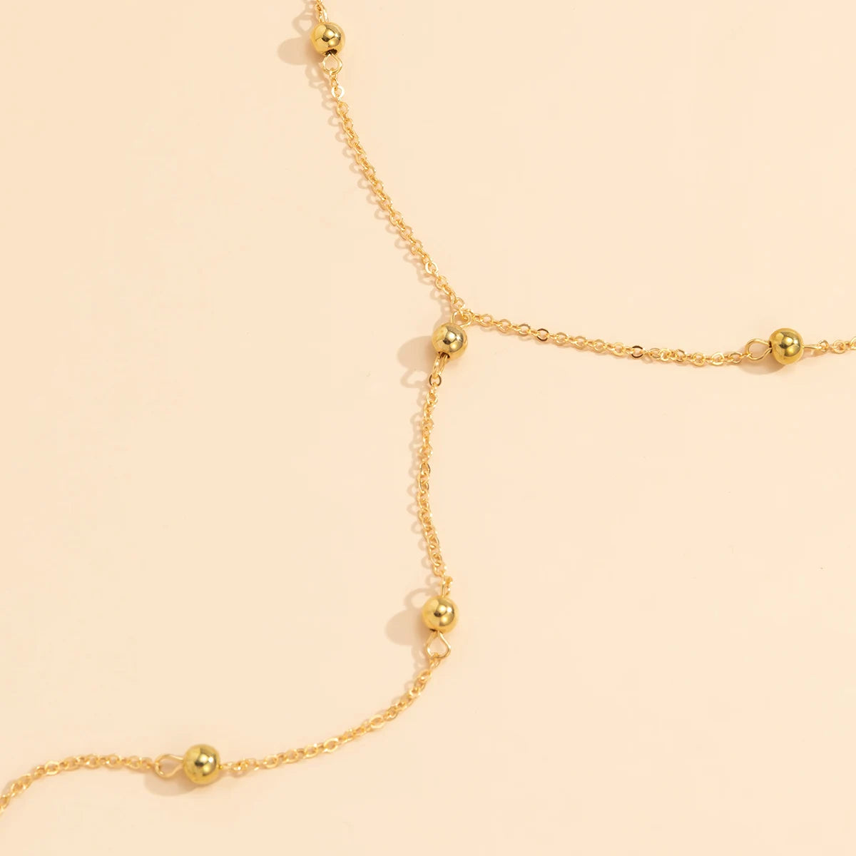 Collier long en Y à billes dorées – vue 5