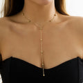 Collier ras du cou en Y à billes dorées – doré