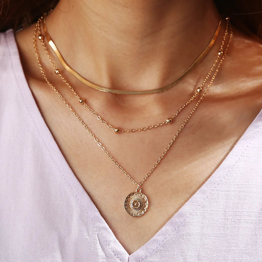 Collier multirang à pendentif barre – doré